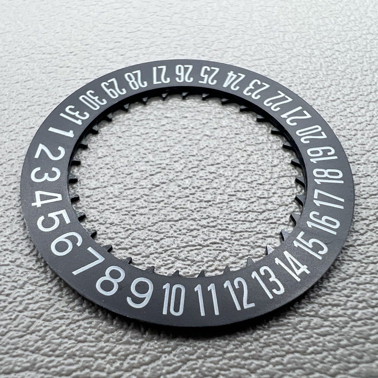 Black date disk wheel showing date at 6 o'clock, compatible with NH34 NH35 movement, precision watch part.