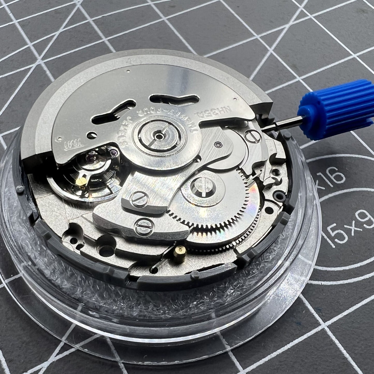 Black NH35 Seiko automatic watch movement with date at 6, precise self-winding mechanical mechanism.