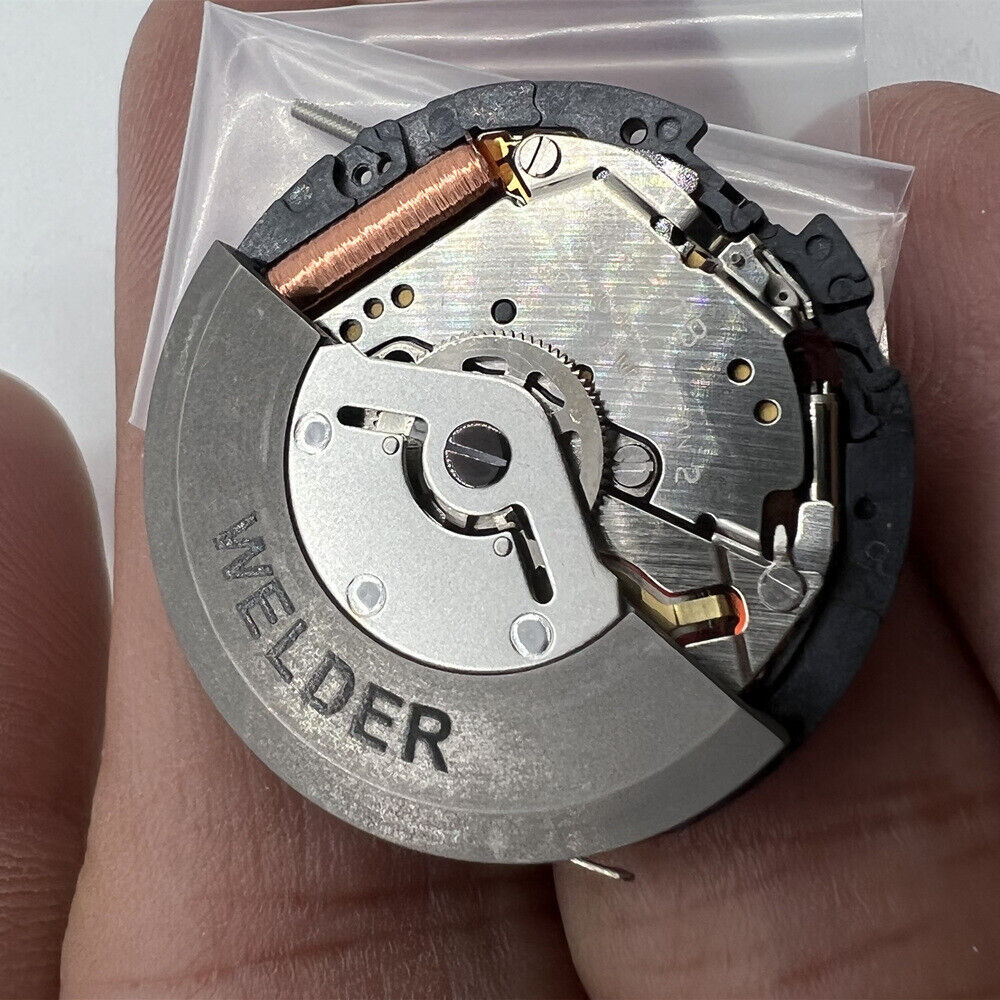 Seiko Japan Made YT57 watch accessory showcasing kinetic autoquartz movement with 3 hands and calendar.