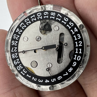 Tissot ETA C01.211 chronograph movement with black dial, precision mechanical watch accessory.