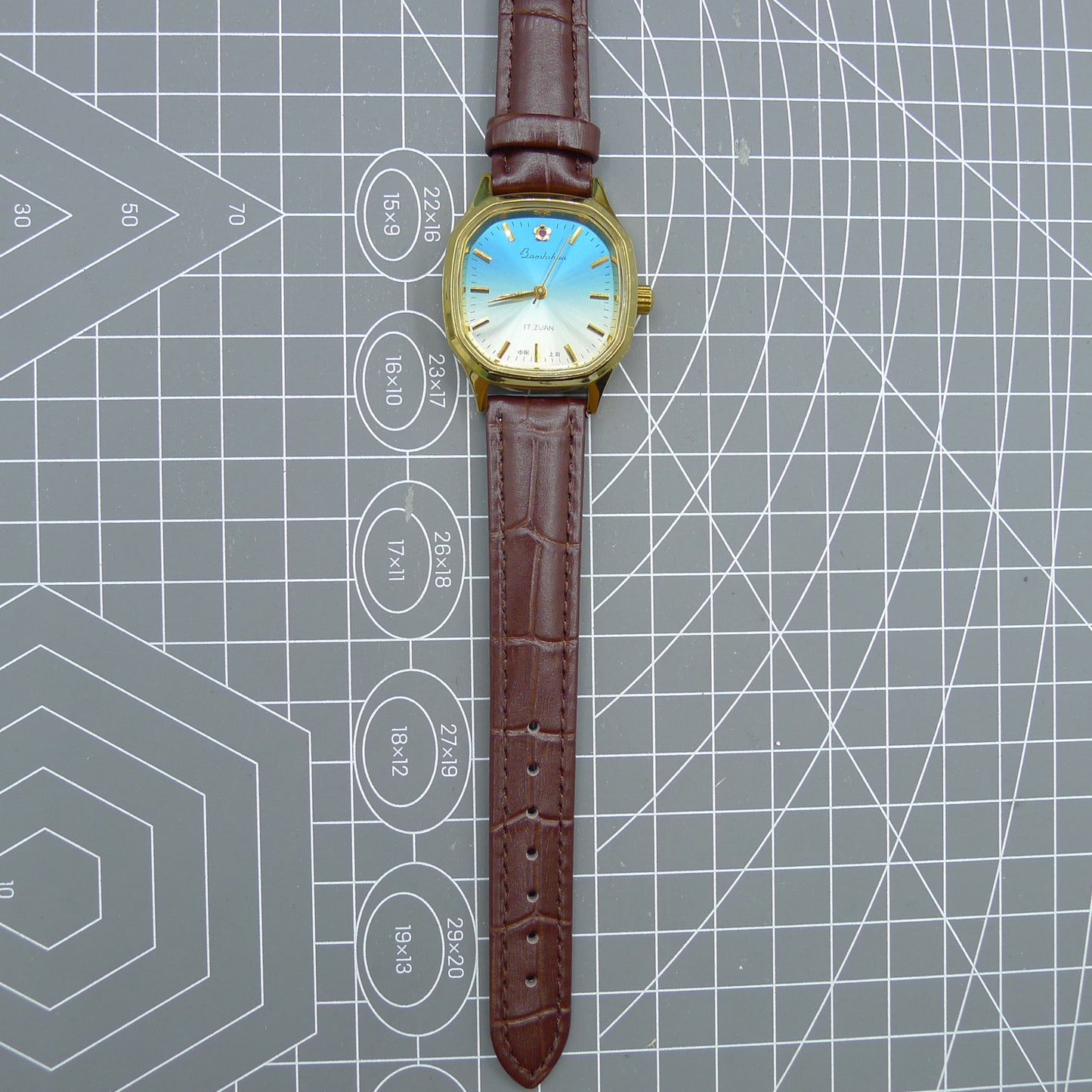 Shanghai 33mm manual mechanical watch with blue dial, gold markers, square case, 17 jewels movement for classic style.