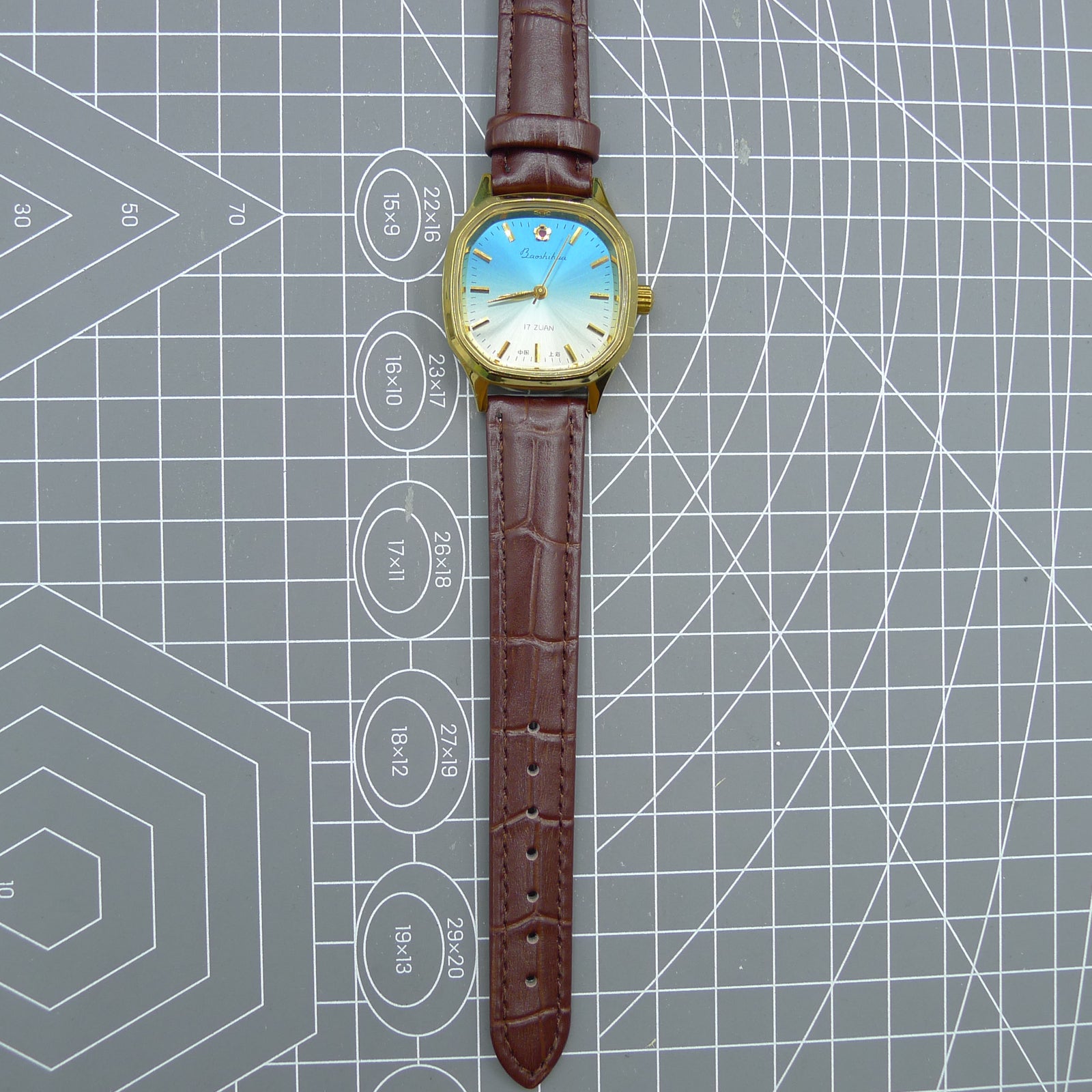 Shanghai 33mm manual mechanical watch with blue dial, gold markers, square case, 17 jewels movement for classic style.