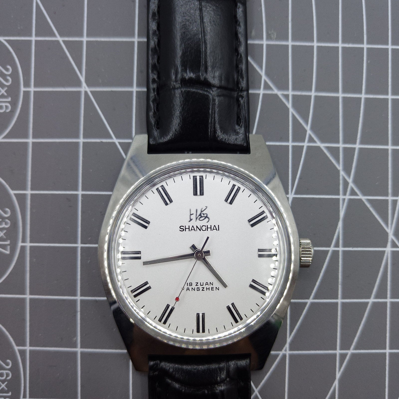 Shanghai Factory 38mm manual mechanical watch with white dial, 3 hands, 19 jewels, classic elegance.