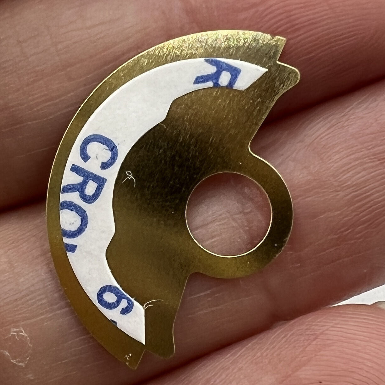 Golden waved metal sheet overlay for Miyota 9015 rotor, enhancing watch accessory style and durability