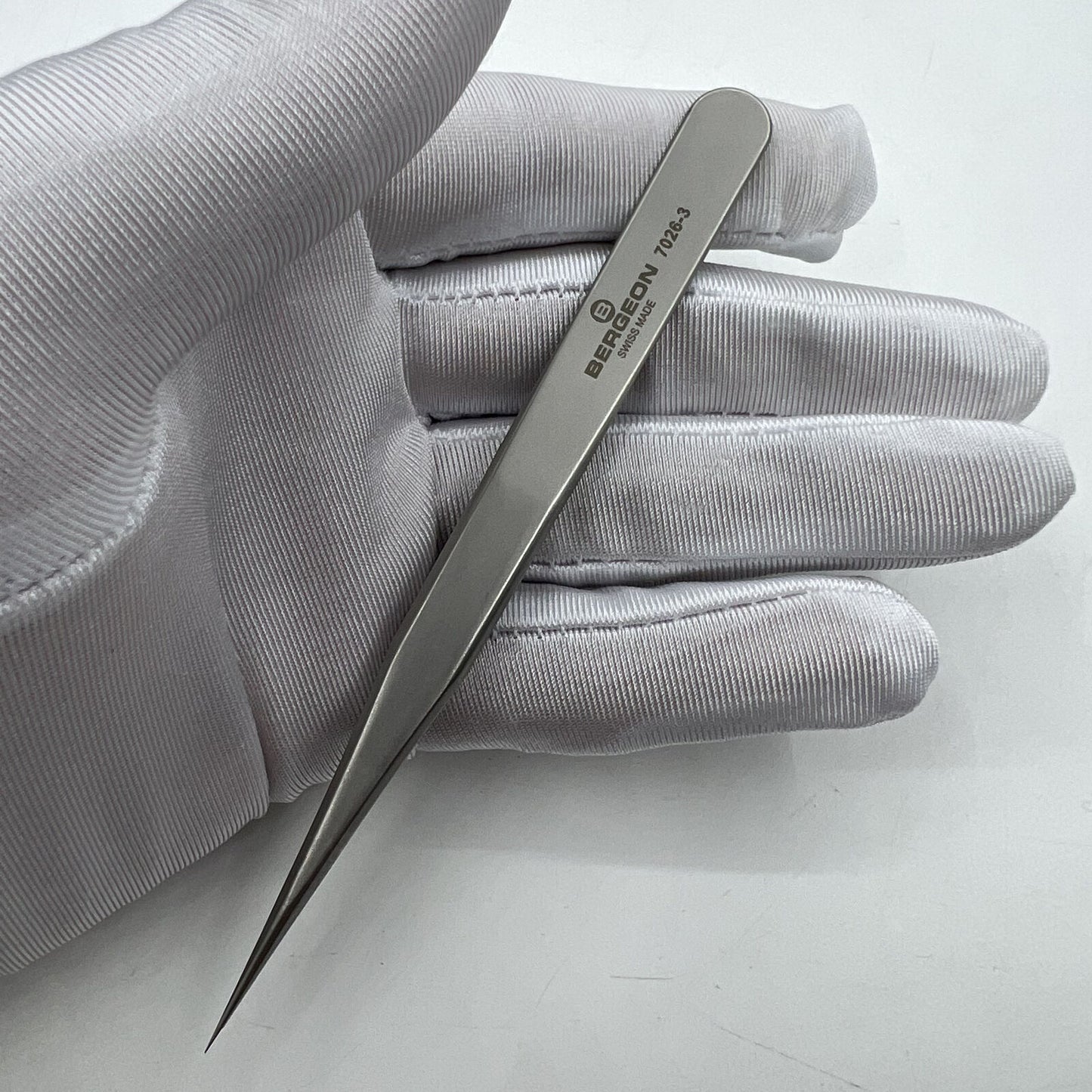 Swiss Bergeon model 7026-3 antimagnetic fine hairspring tweezers for precise watch repair tasks.