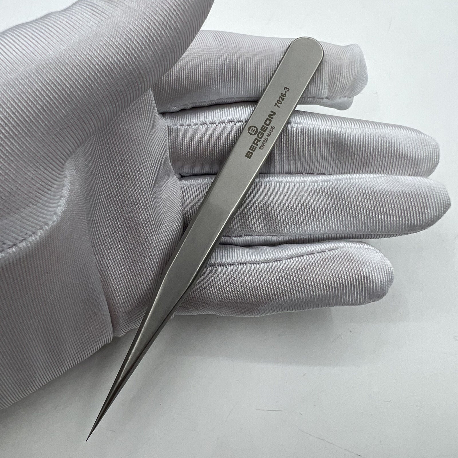 Swiss Bergeon model 7026-3 antimagnetic fine hairspring tweezers for precise watch repair tasks.