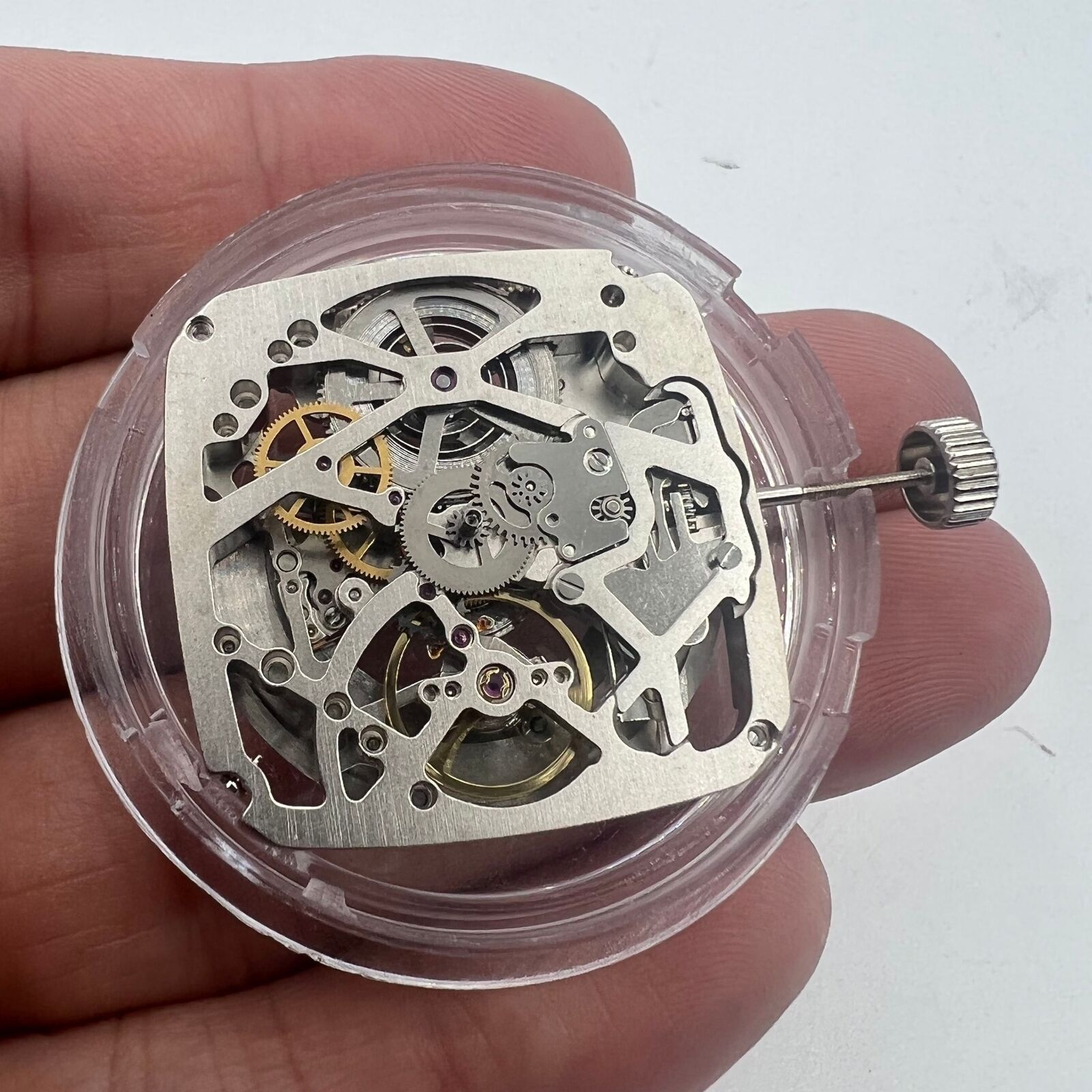 Tianjin Seagull ST25 silver square mechanical watch movement with 3 hands and skeleton design for watchmakers.