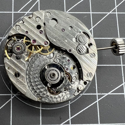 Hangzhou automatic kinetic watch with small second at 4, Chinese craftsmanship highlighting precise movement and no rotor.