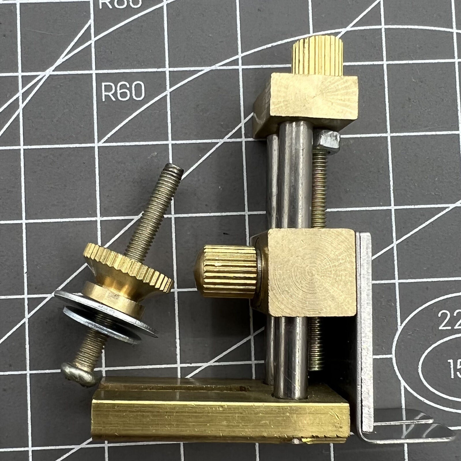 Auxiliary positioning tool for precise watch stem cutting with cutter plier accessory.