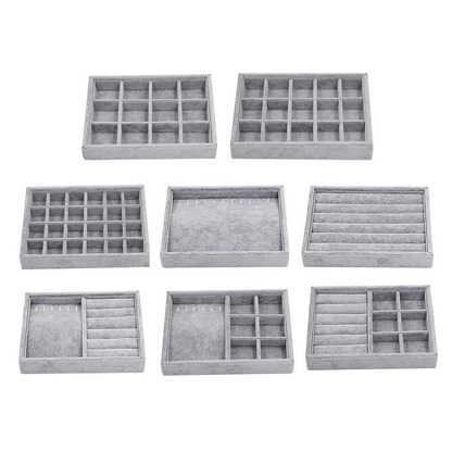 Gray velvet stackable jewelry organizer tray with grid compartments for elegant accessory storage.