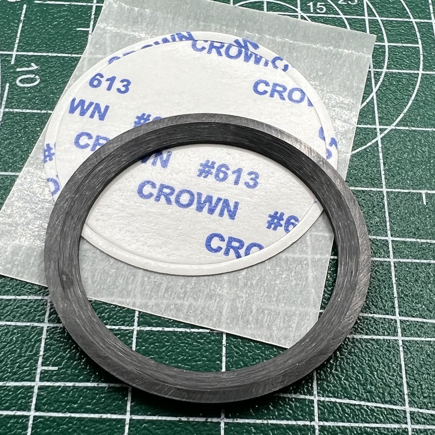 Black ceramic watch bezel insert with orange graduation, 38mm/30.5mm, perfect for watch repairs and customization.