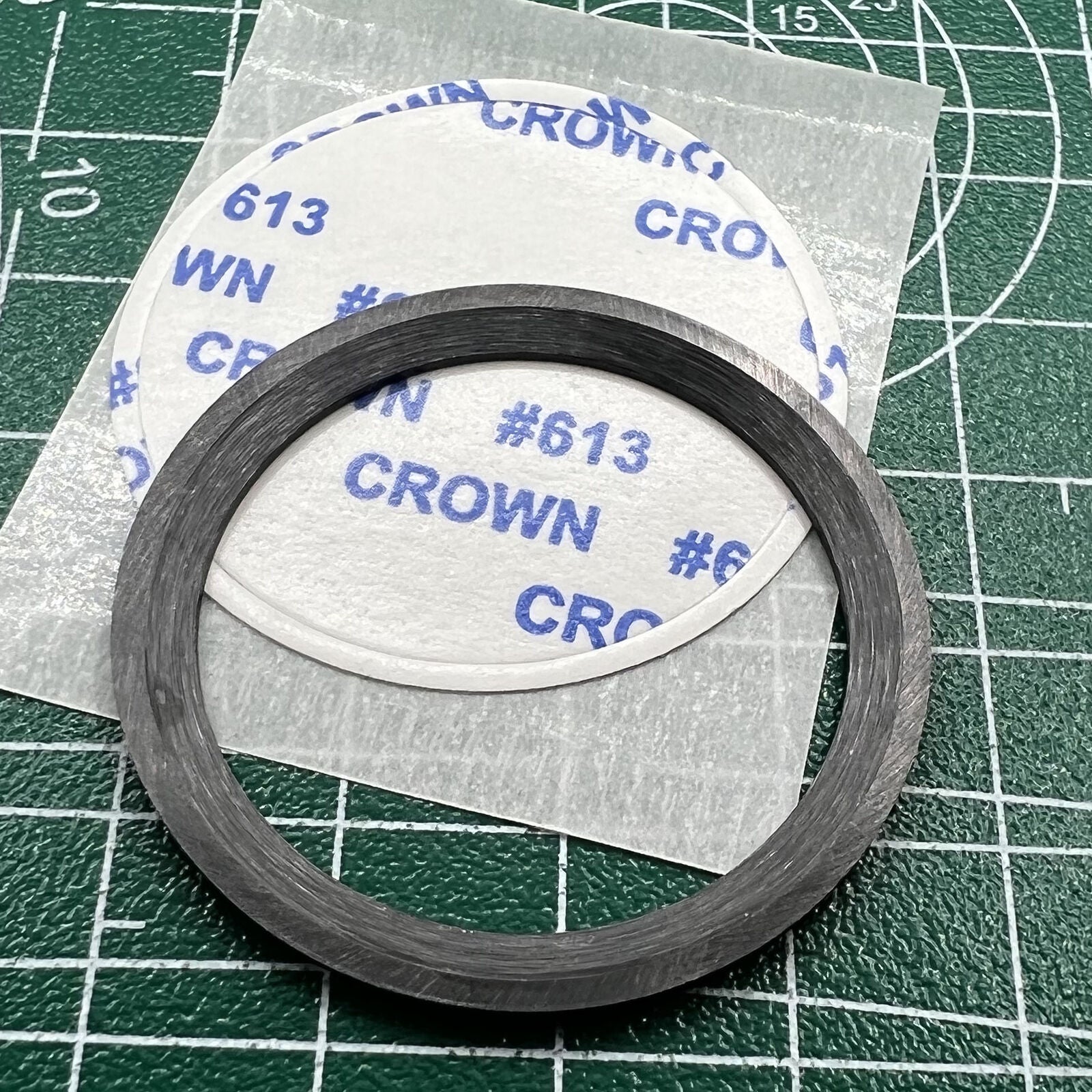 Black ceramic watch bezel insert with orange graduation, 38mm/30.5mm, perfect for watch repairs and customization.