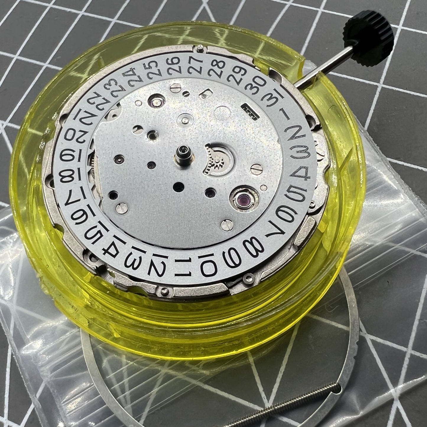 Miyota/Citizen 9019 automatic mechanical watch movement showing date window at 3 and 6, Japan made.