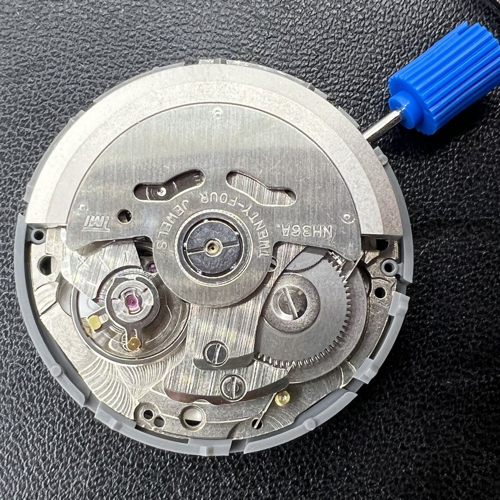 Seiko Japan automatic watch movement NH36A mechanism for precise timekeeping.