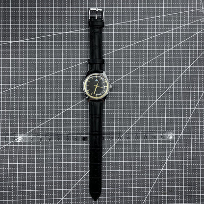 Taihang 32mm manual mechanical watch with black strap, golden nails, and black dial for classic style.