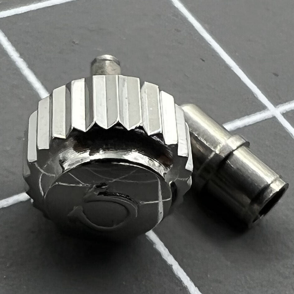 Polished 6.3mm silver OMEGA Seamaster 300 watch crown with tube, precise replacement accessory.