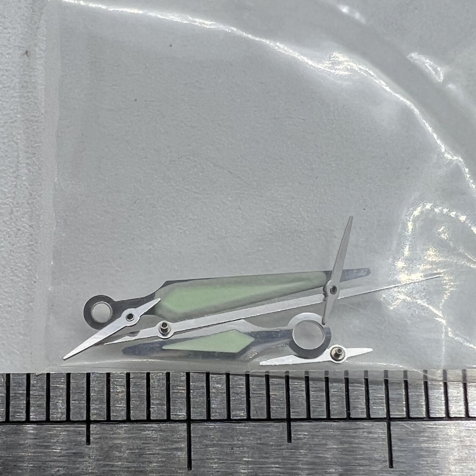 Silver trim luminous watch hands by ETA for G10.211 quartz movement, enhancing readability and style.