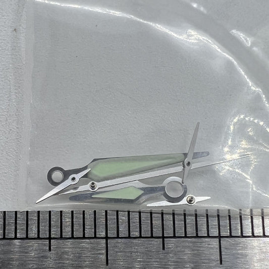 Silver trim luminous watch hands by ETA for G10.211 quartz movement, enhancing readability and style.