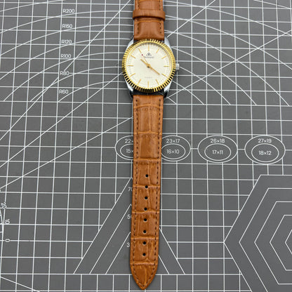 TAIHANG 38mm manual mechanical watch with silver dial, gold hour markers, round case, 17 jewels for precision.