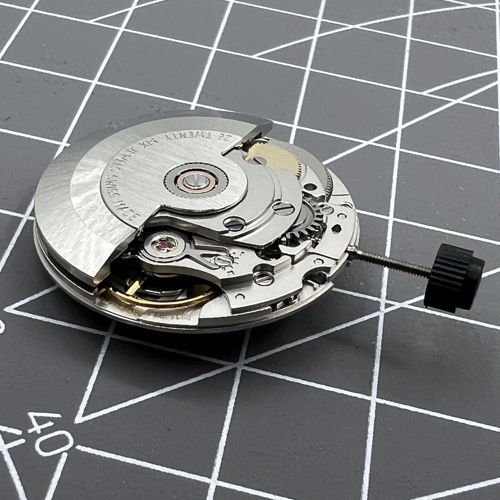 Silver ETA SW200-1 automatic watch movement, high-precision mechanical replacement for seamless timekeeping.