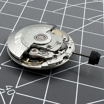 Silver ETA SW200-1 automatic watch movement, high-precision mechanical replacement for seamless timekeeping.