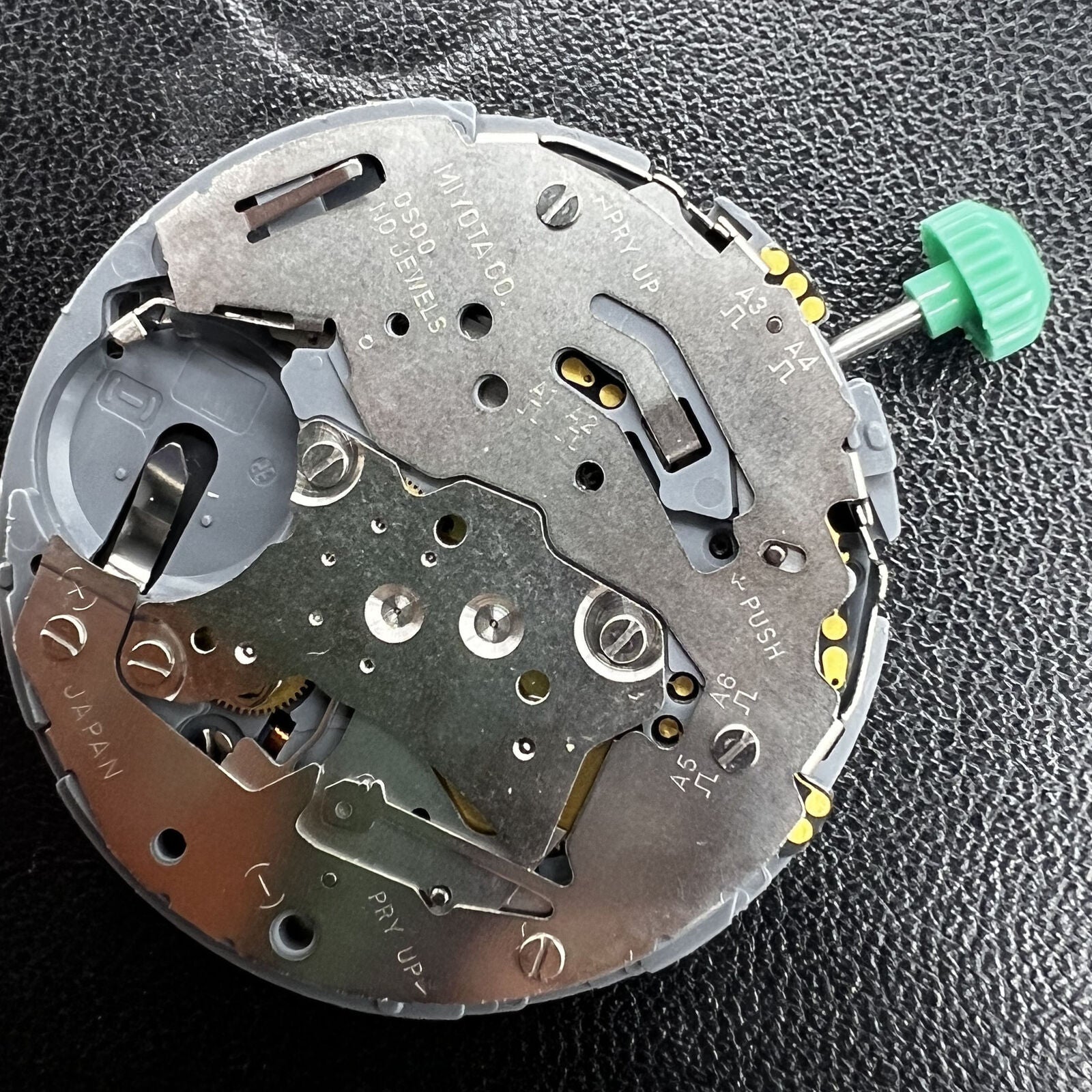 Miyota OS00 Quartz watch showcasing multifunctional date and single calendar at 3 o'clock for precise timekeeping.