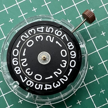 Swiss Ronda 509 quartz watch movement with black disk date at 3 o?clock, ideal for watch repairs.
