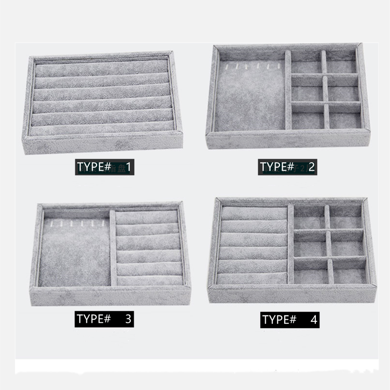 Gray velvet stackable jewelry organizer tray with grid compartments for elegant accessory storage.