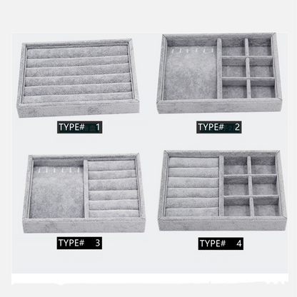 Gray velvet stackable jewelry organizer tray with grid compartments for elegant accessory storage.