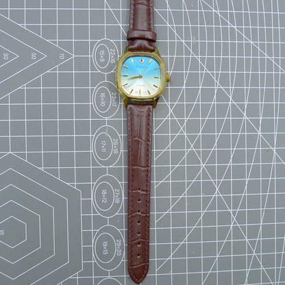 Shanghai 33mm watch with blue dial, gold nail markers, square case, manual mechanical movement, 17 jewels.