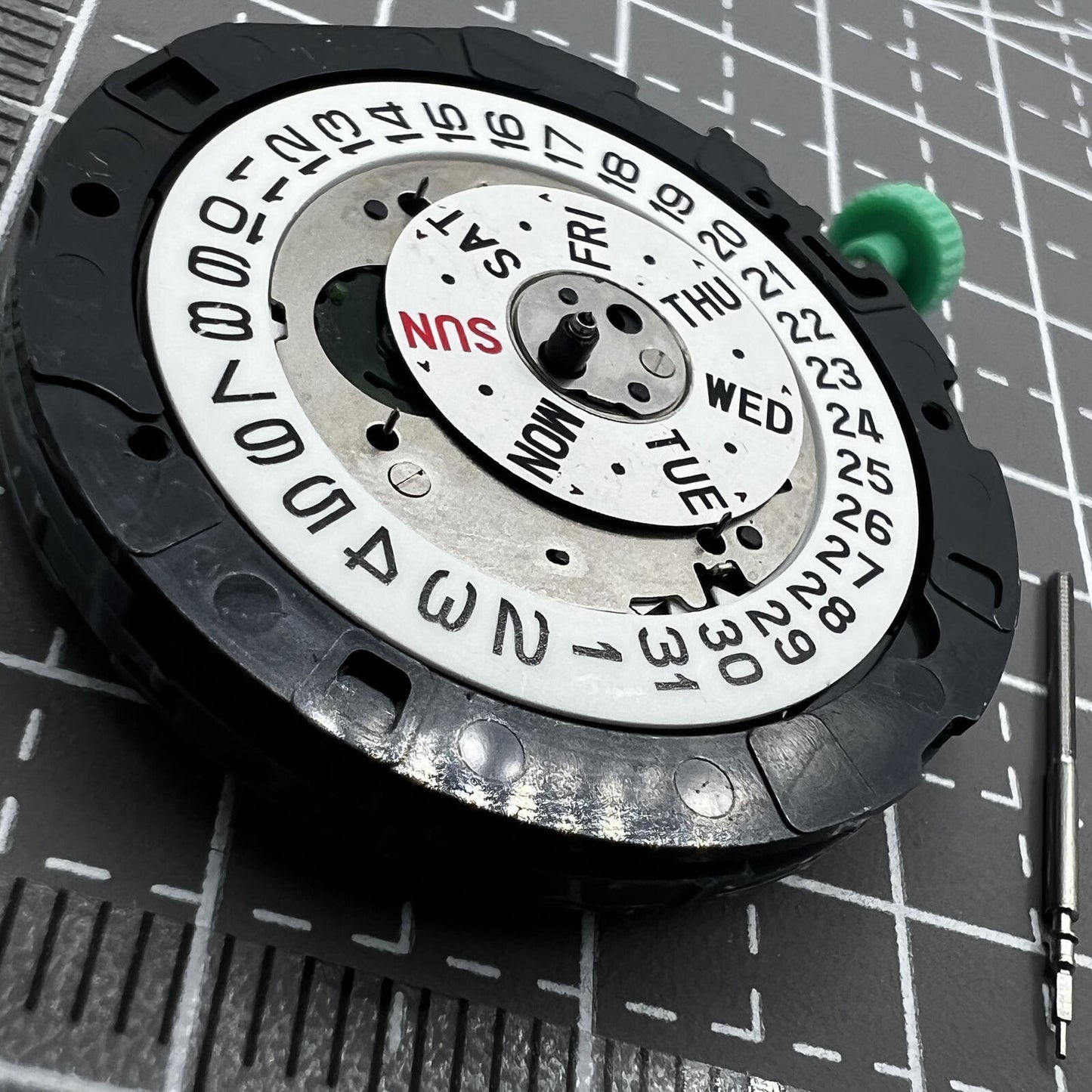 Miyota OS00 Quartz watch displaying multifunctional date and single calendar at 3 o'clock slot