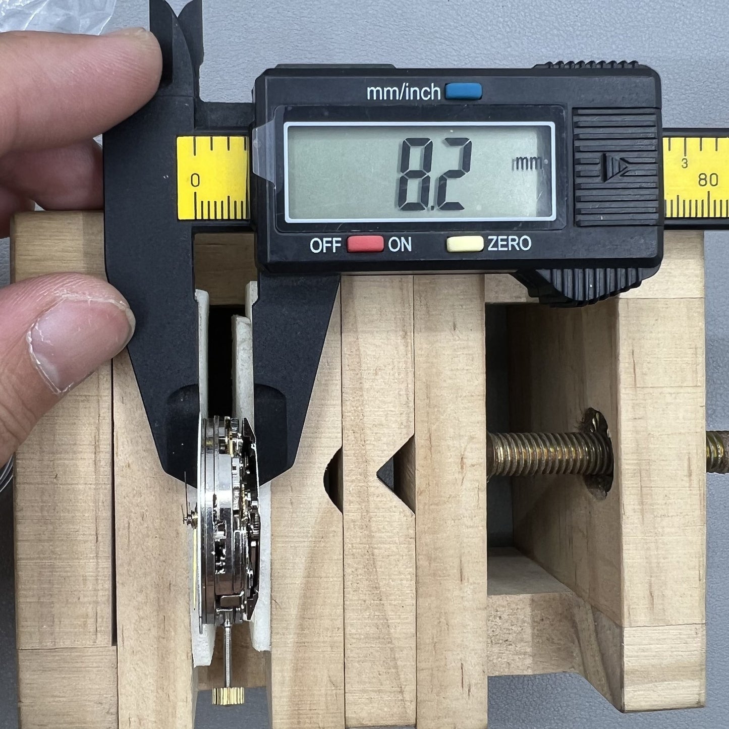 Dandong 7750 mechanical watch movement showing single calendar and small second subdials at 6, 9, 12 o'clock positions for precision timekeeping.