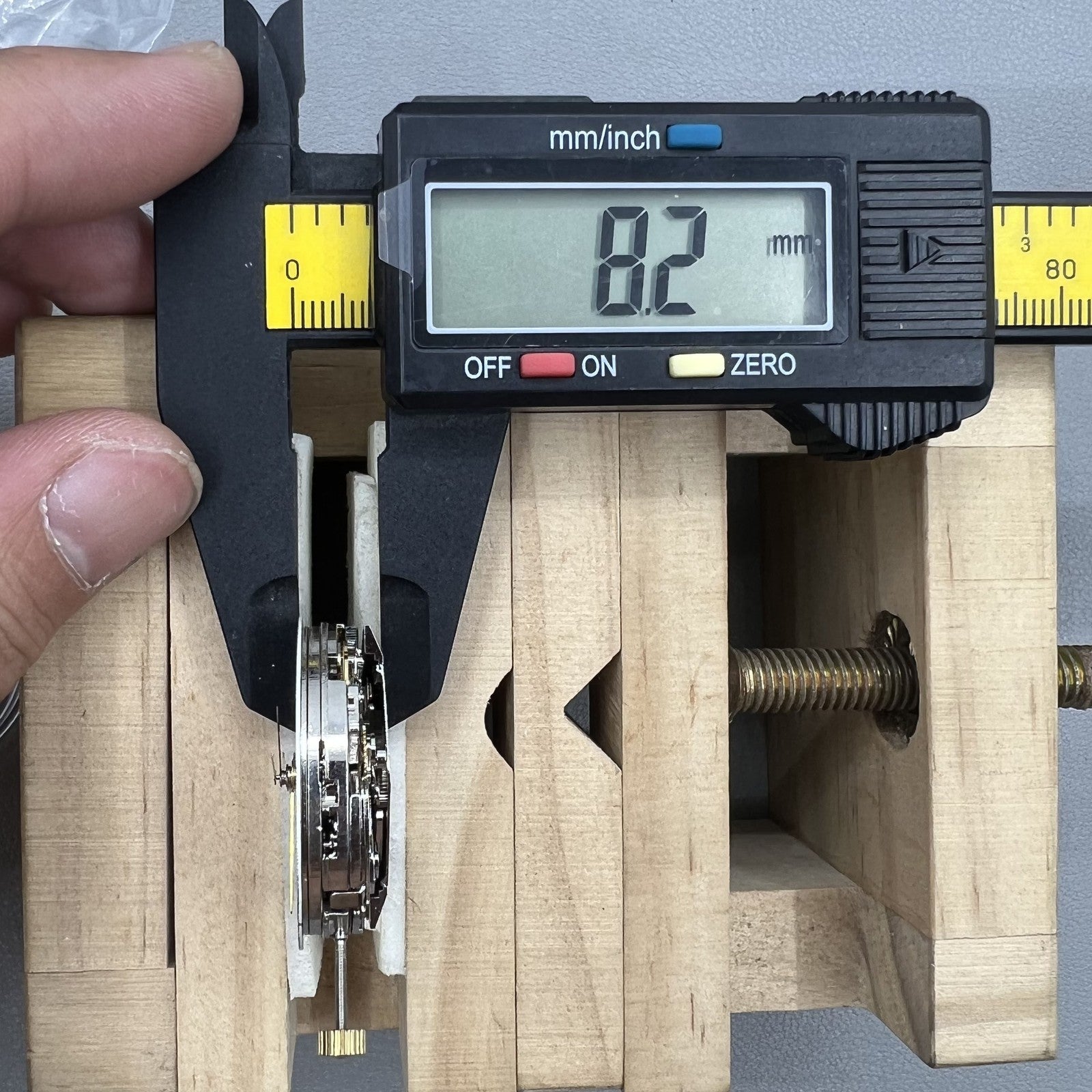 Dandong 7750 mechanical watch movement showing single calendar and small second subdials at 6, 9, 12 o'clock positions for precision timekeeping.