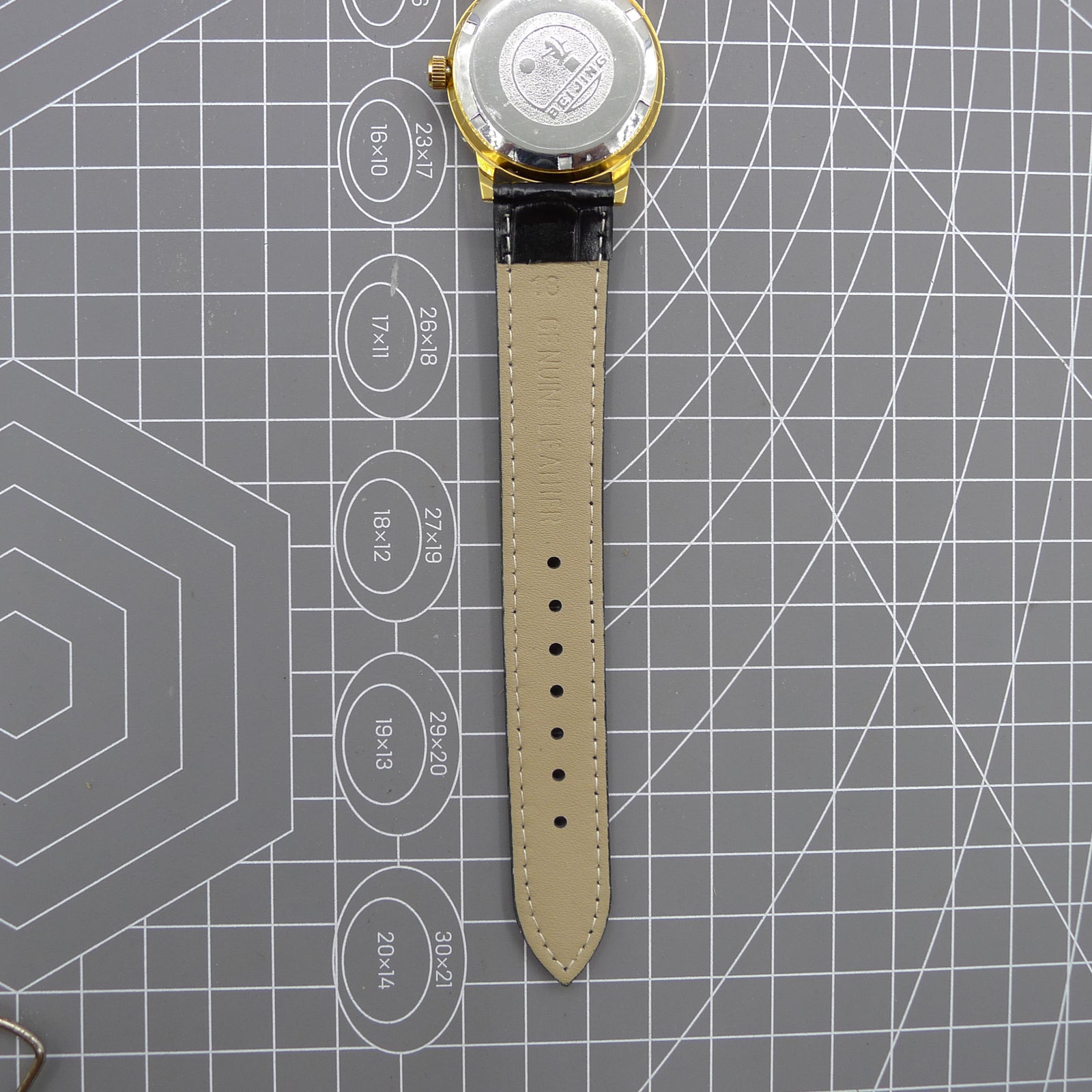 Beijing Double Rhomb mechanical watch in golden case with silver hour markers, elegant style for formal occasions.