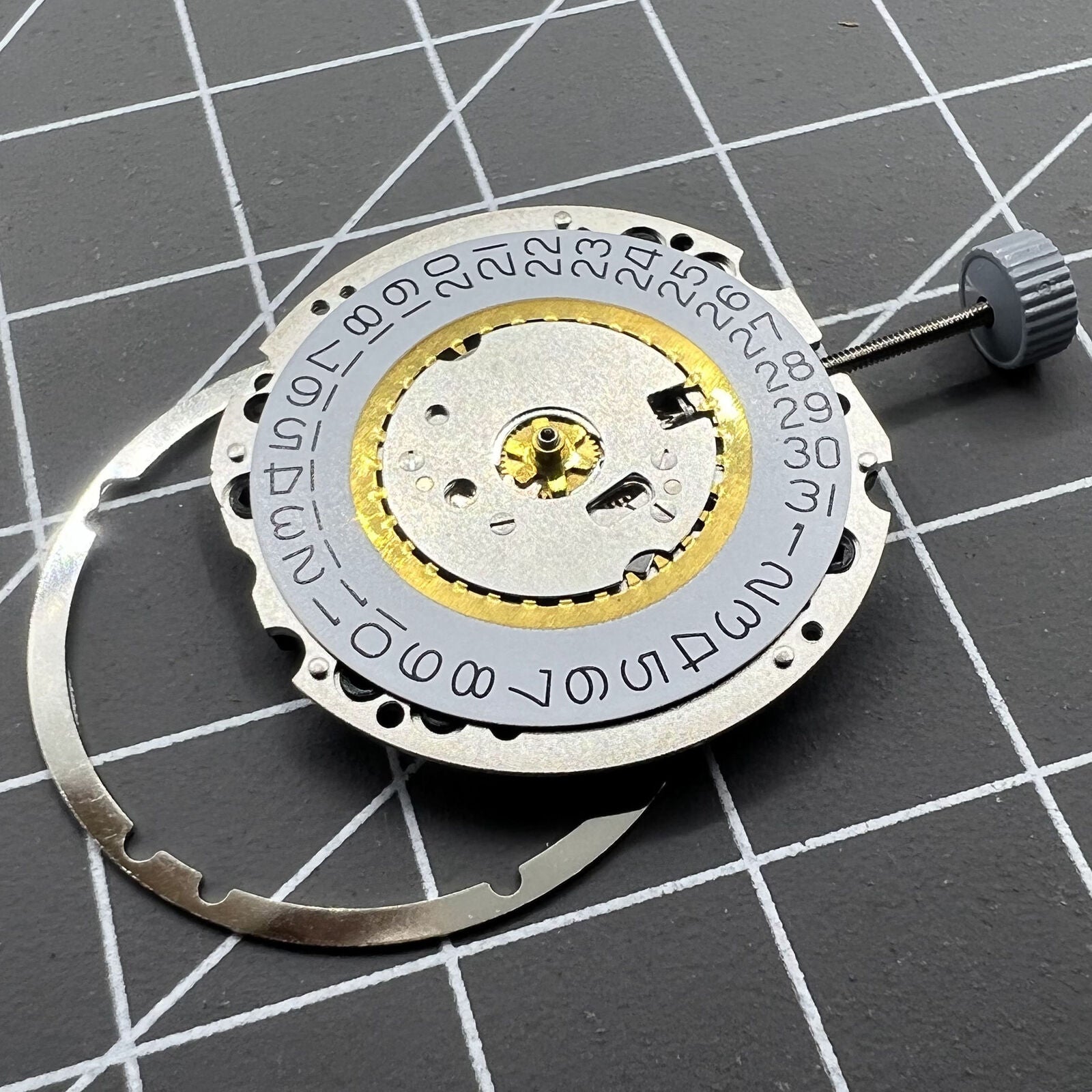 Swiss Made Ronda 705 quartz watch movement with date display at 3 o'clock for precise timekeeping