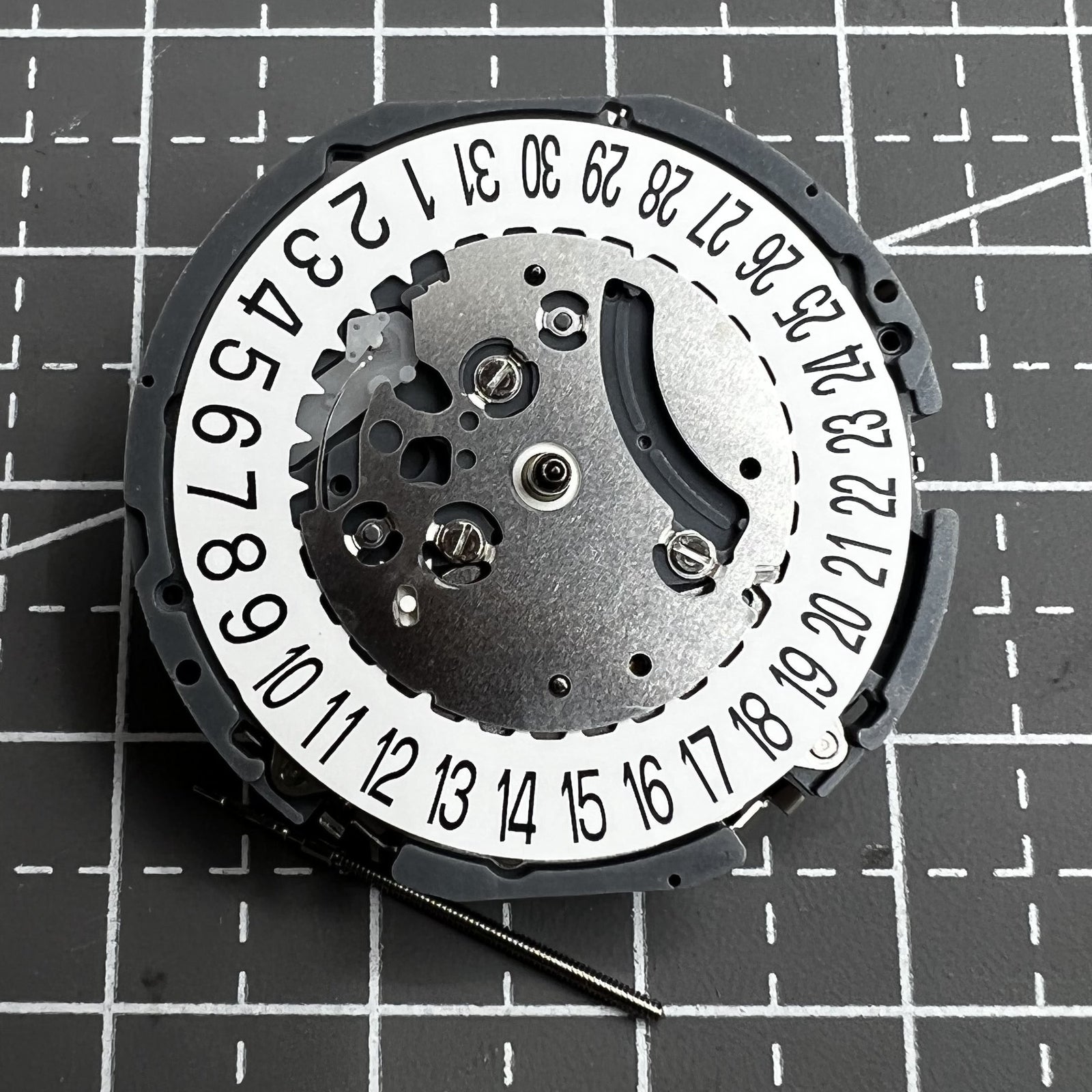 Japan Hattori VK64A quartz watch movement with date display at 6 o'clock, precise timekeeping.