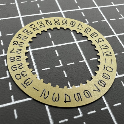 Vintage gold-tone date disc with numerals for RLX3135 watch movement, perfect for classic timepieces.