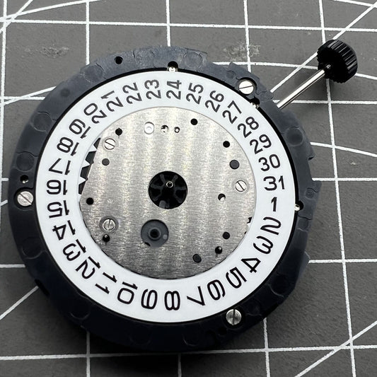 Miyota 6S10 quartz watch movement with small second hands at 6, 9, 12 o'clock positions and date at 3.