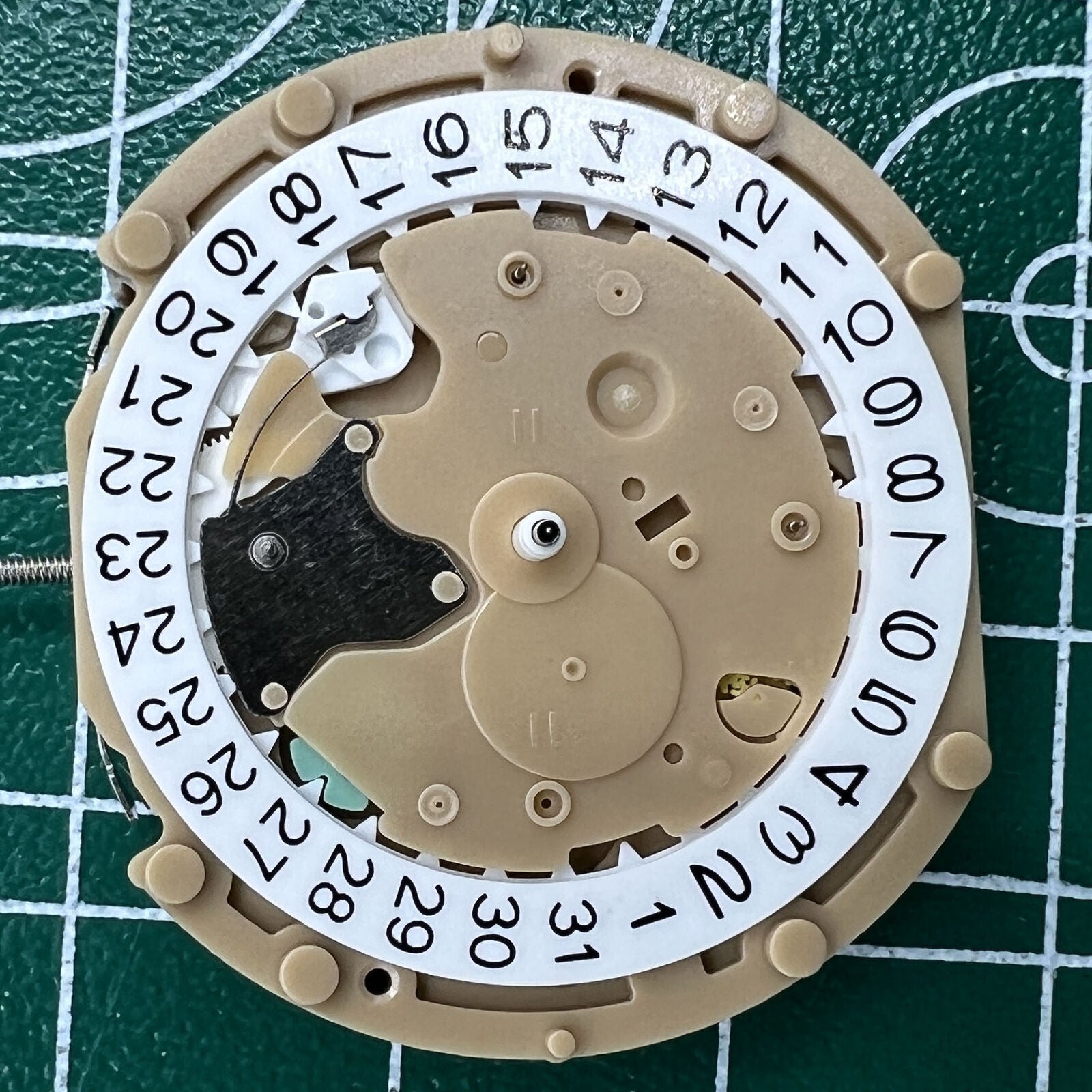 Sunon PE60 quartz watch with date at 3, small seconds at 6, and classic 3-hand design.