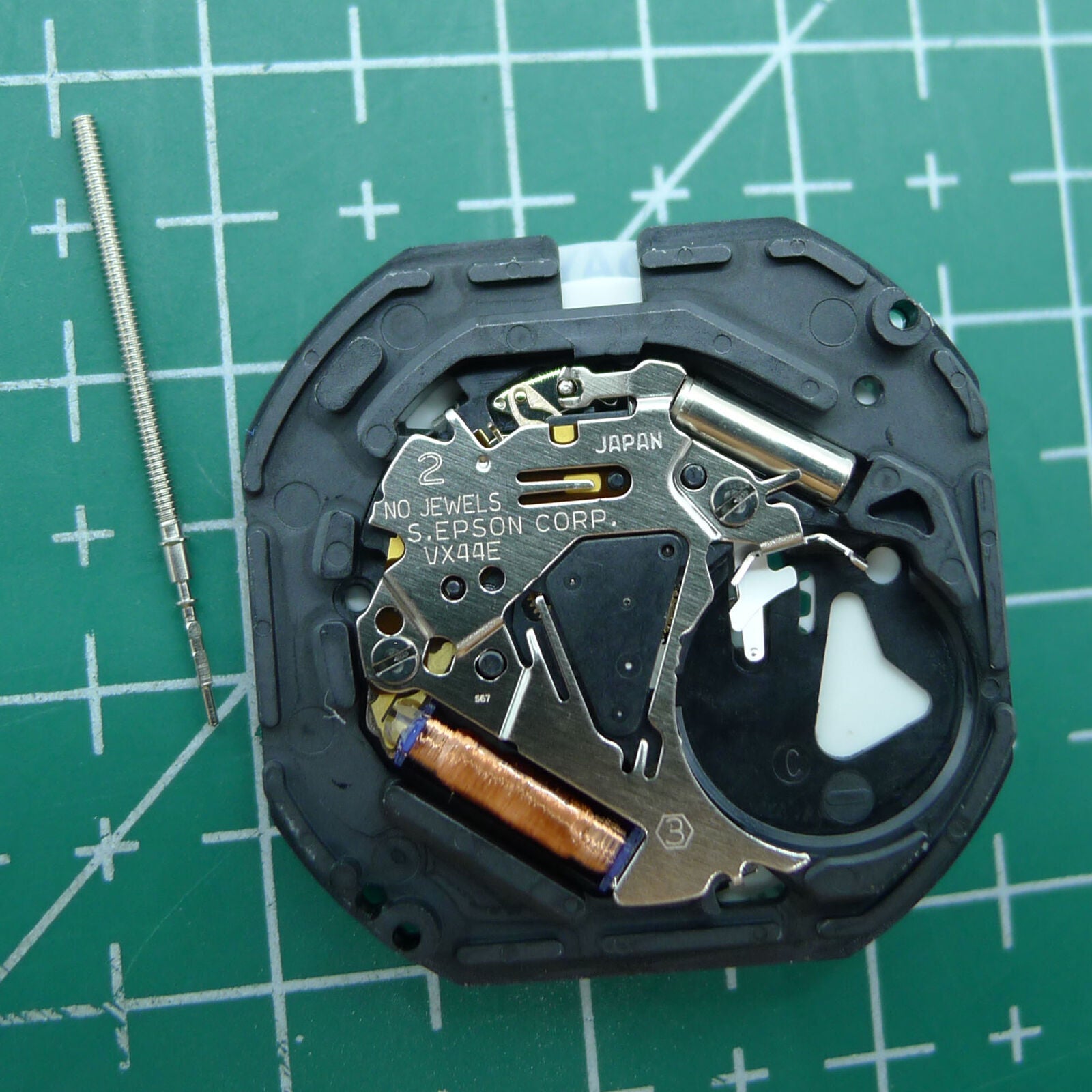 Hattori Epson VX44E white dial quartz watch movement, precise timekeeping for watch repairs