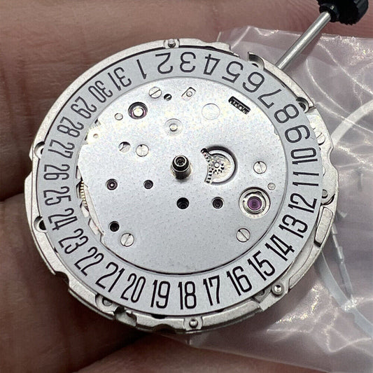 Miyota Citizen 9015 automatic mechanical movement with date display at 3 o?clock, precision watch part.