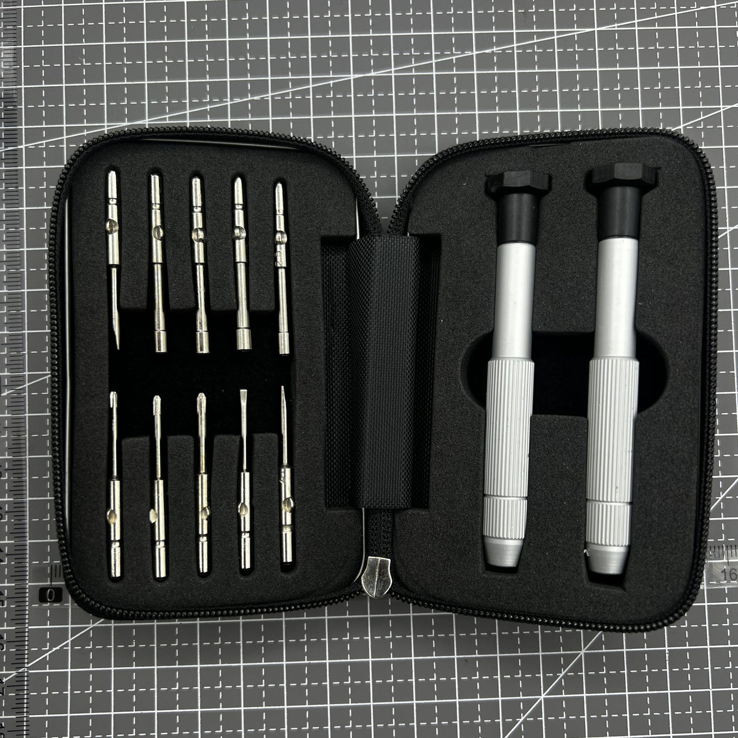 Precision screwdriver set with hex tools for watches and glasses repair, ergonomic grip.