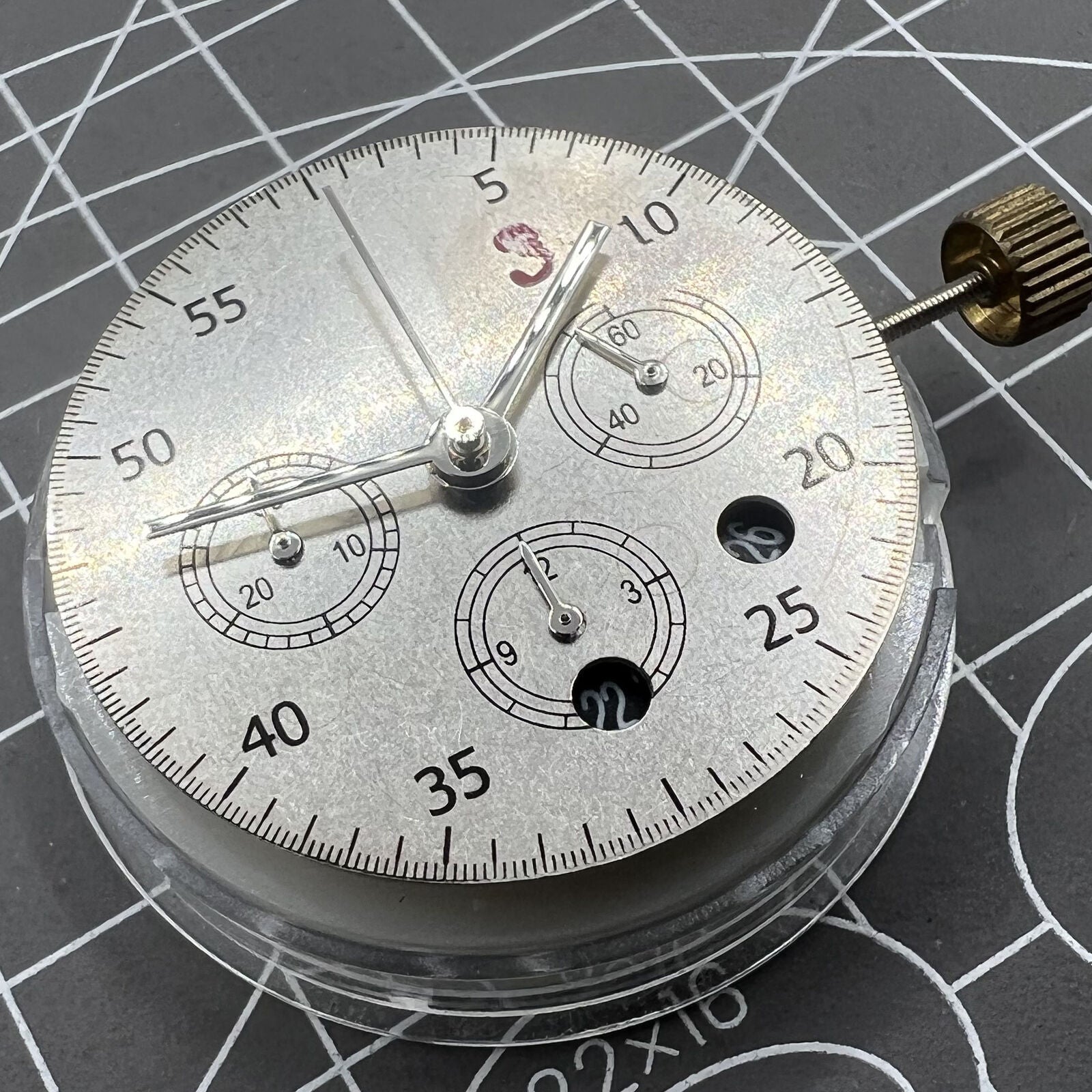 Dandong 7750 mechanical watch movement with black dial, small second at 6 o'clock, date display.
