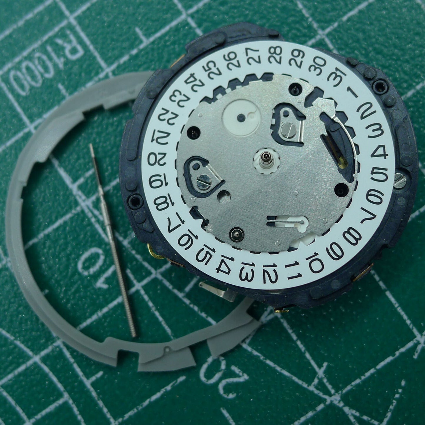 Hattori Epson TMI YM12 quartz watch movement for precise timekeeping, Japan made, ideal for watch repairs.