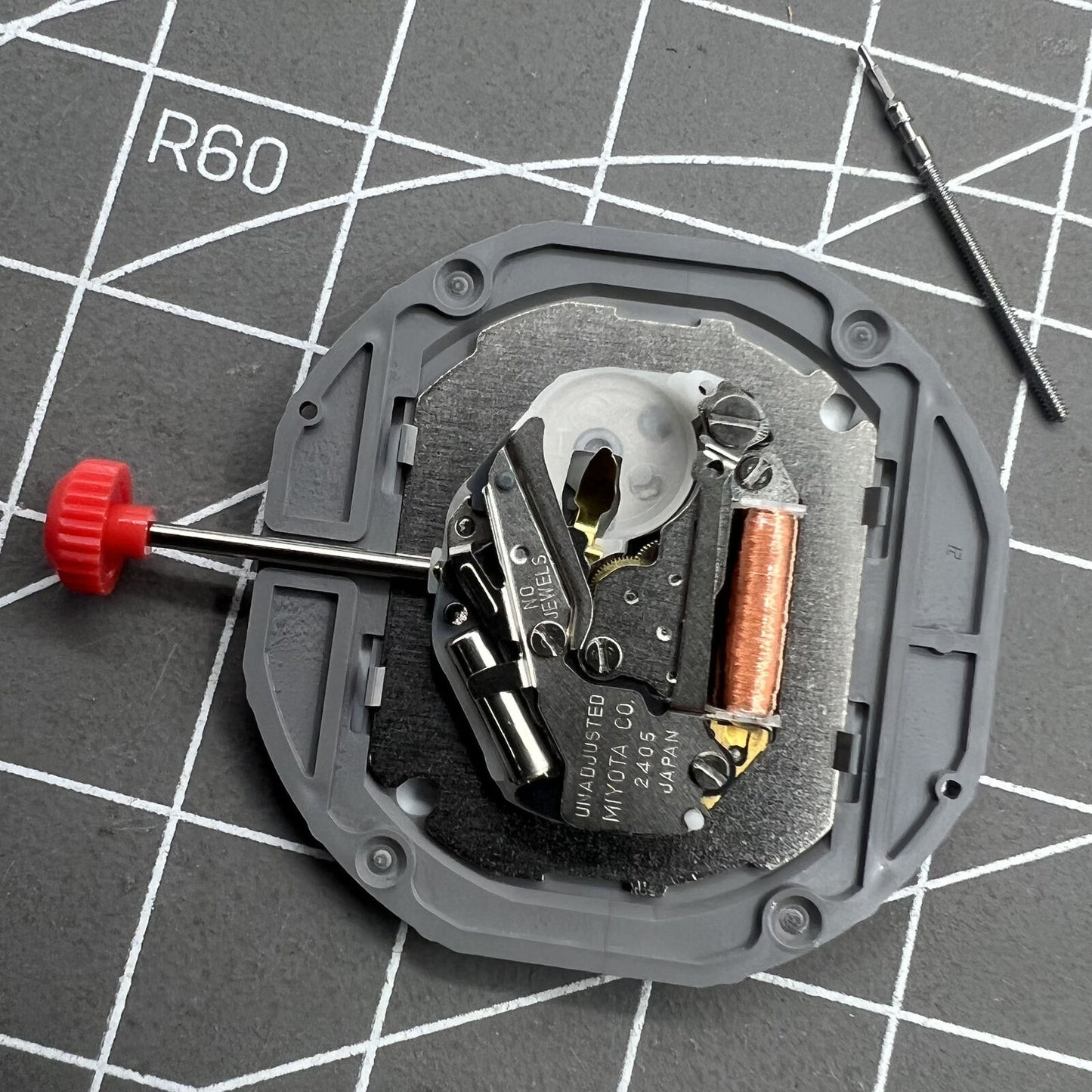 Miyota 2405 Japan Quartz Movement mechanism for precise watch accessory timekeeping.