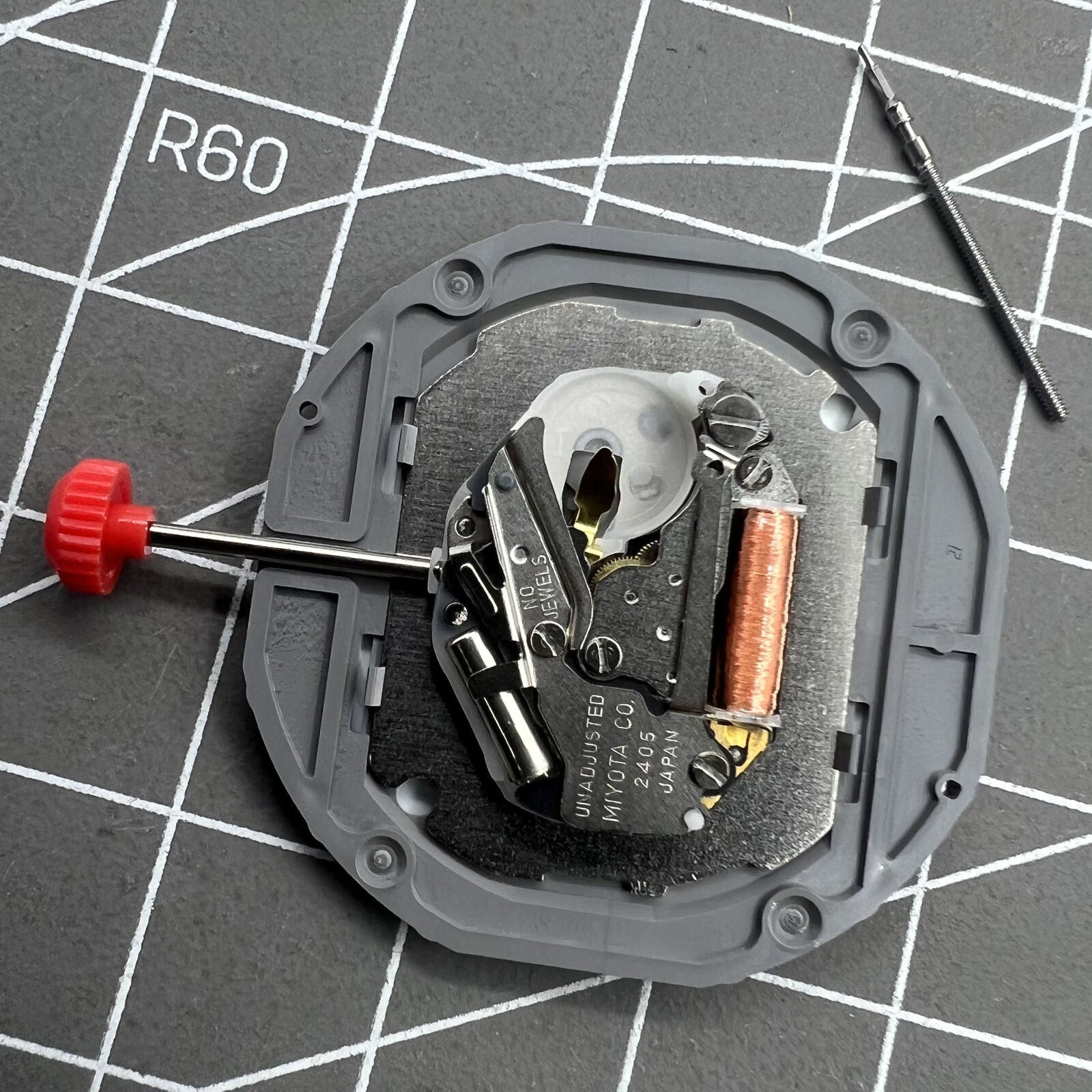 Miyota 2405 Japan Quartz Movement mechanism for precise watch accessory timekeeping.