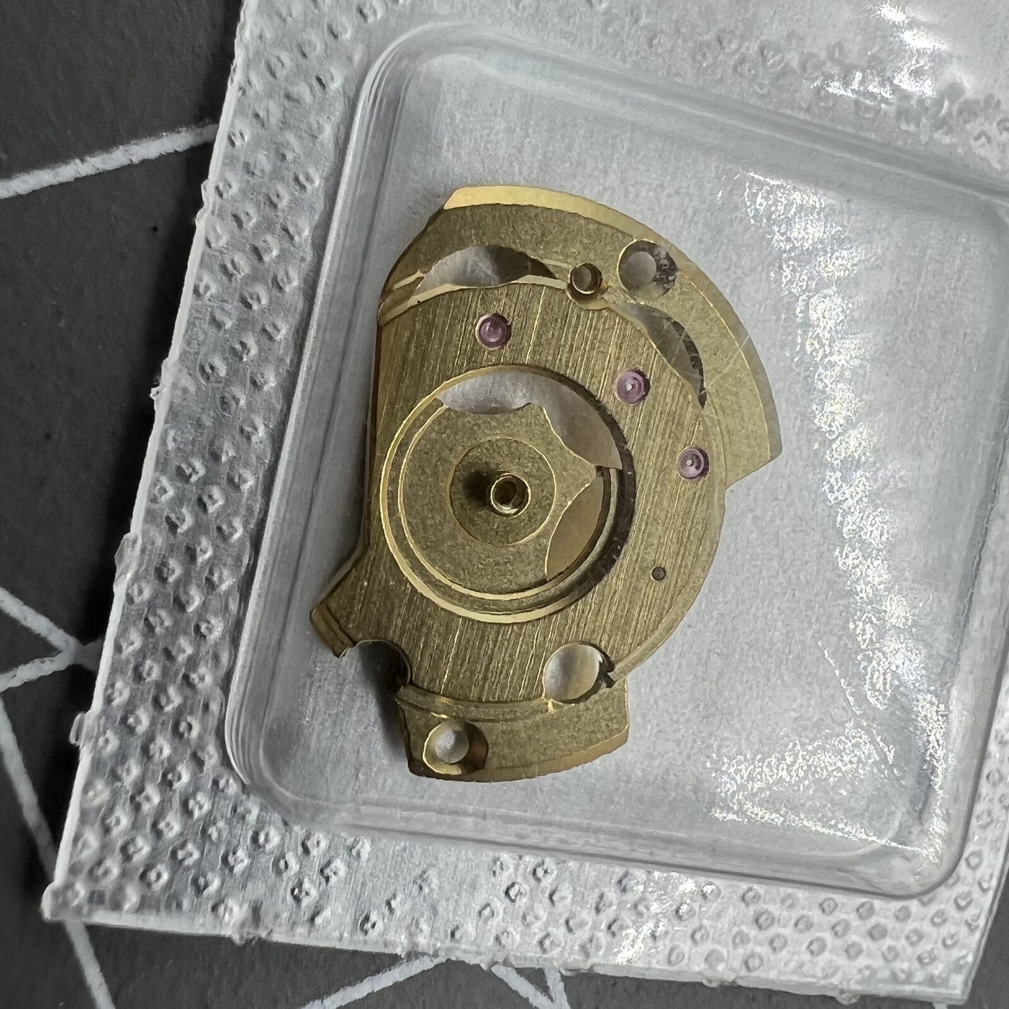 Golden automatic watch wheel bridge spare part for ETA 2671 movement, Swiss Made precision component.