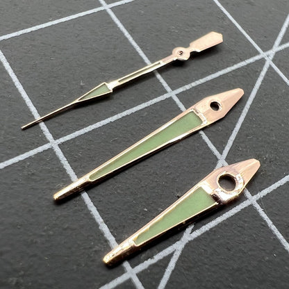 14mm rose gold arrow-shaped luminous watch hands for ISA 2331, green glow, precision accessory.