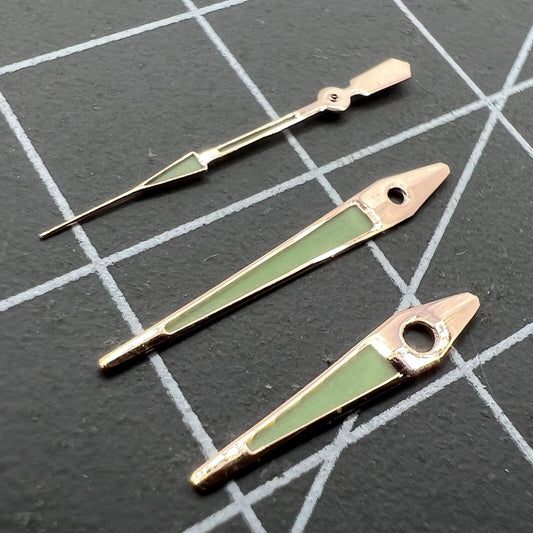 14mm rose gold arrow-shaped luminous watch hands for ISA 2331, green glow, precision accessory.