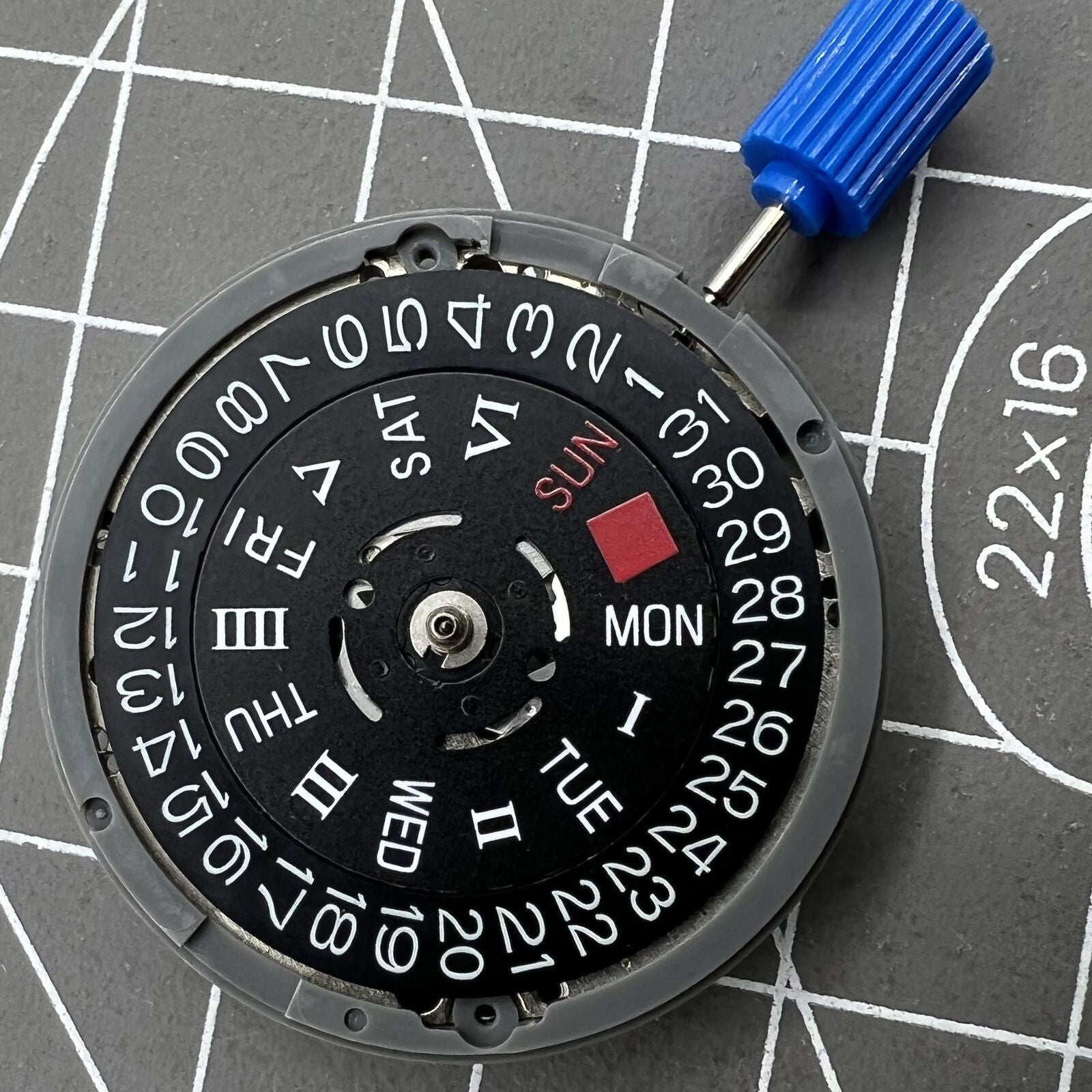 Black NH36A automatic mechanical movement with Roman wheel crown at 3 o'clock.